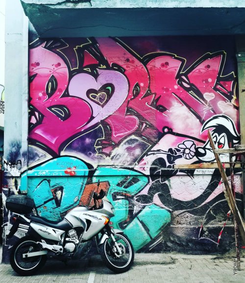 Motorbike in front of pink Heart found in Athens 2021