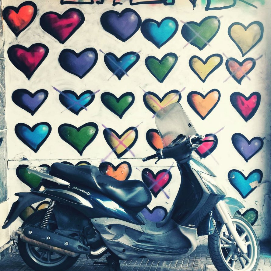 Motorbike in front of street art found in Athens by YROM